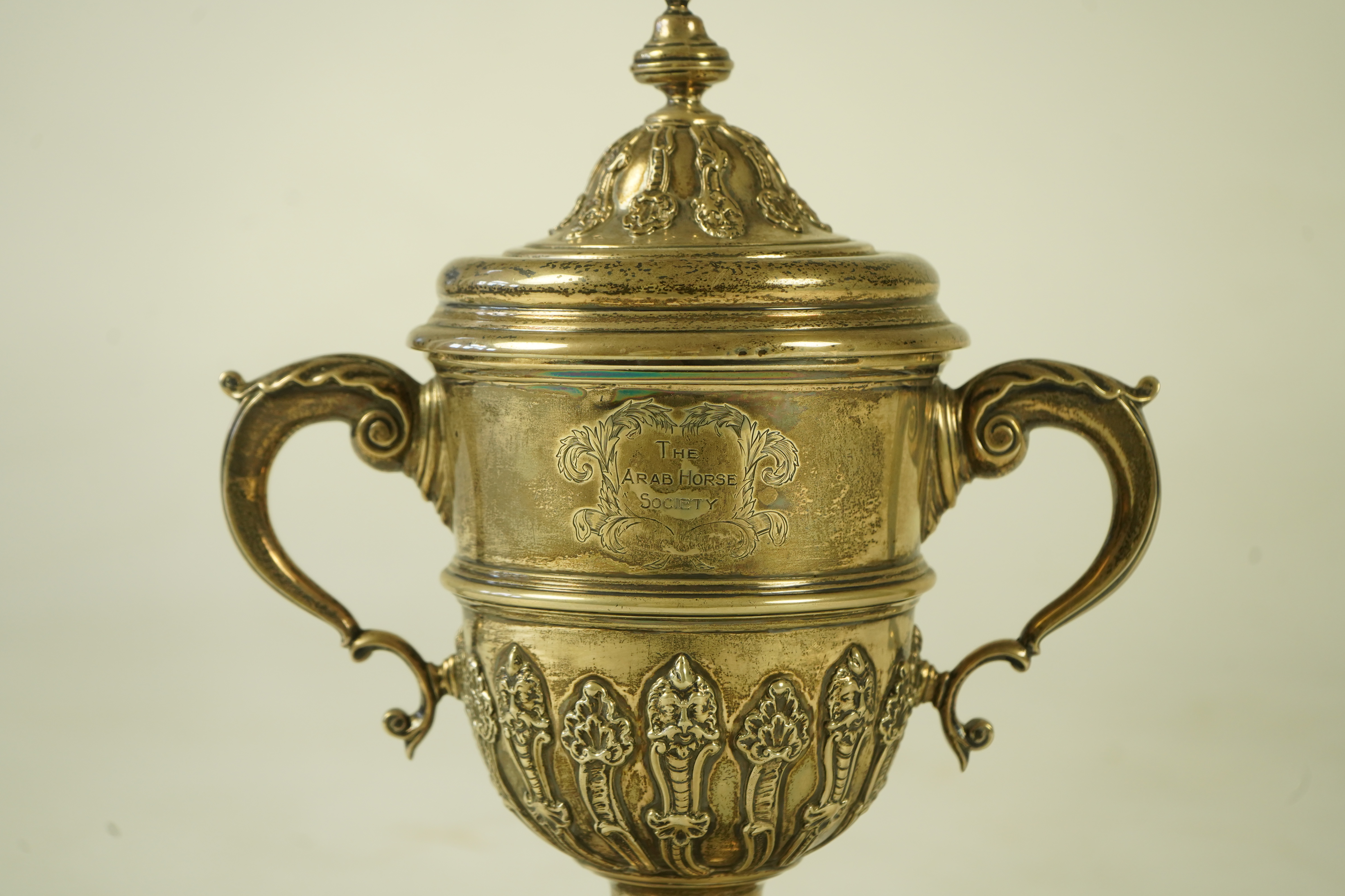 A George V silver two handled presentation cup and cover, by Charles & Richard Comyns, with engraved horse racing inscription relating to 'The Arab Horse Society Challenge Cup Presented by The Rt. Hon. Lady Wentworth for